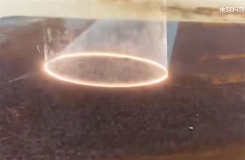  A close-up of laser rust removal from a metal surface