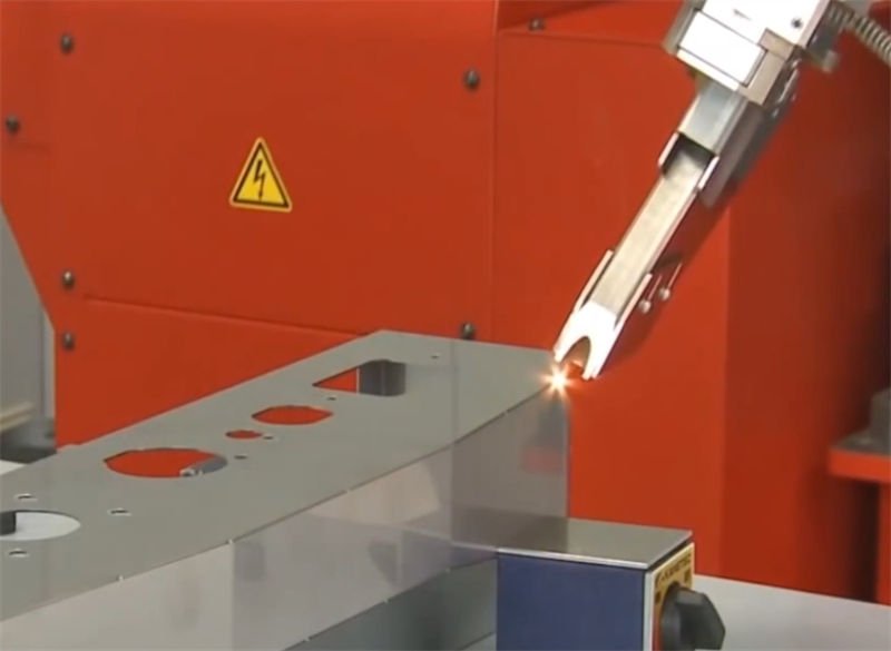 Precision Laser Welding of Component Parts Close-up of a precision laser welding operation on a metal component.