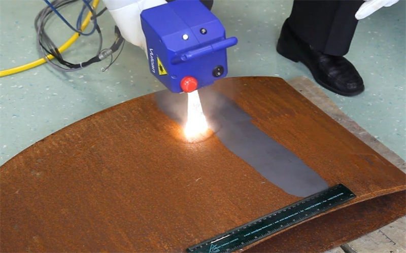 Laser Rust Removal on Industrial Component Laser rust removal process on a metal part with a circular opening