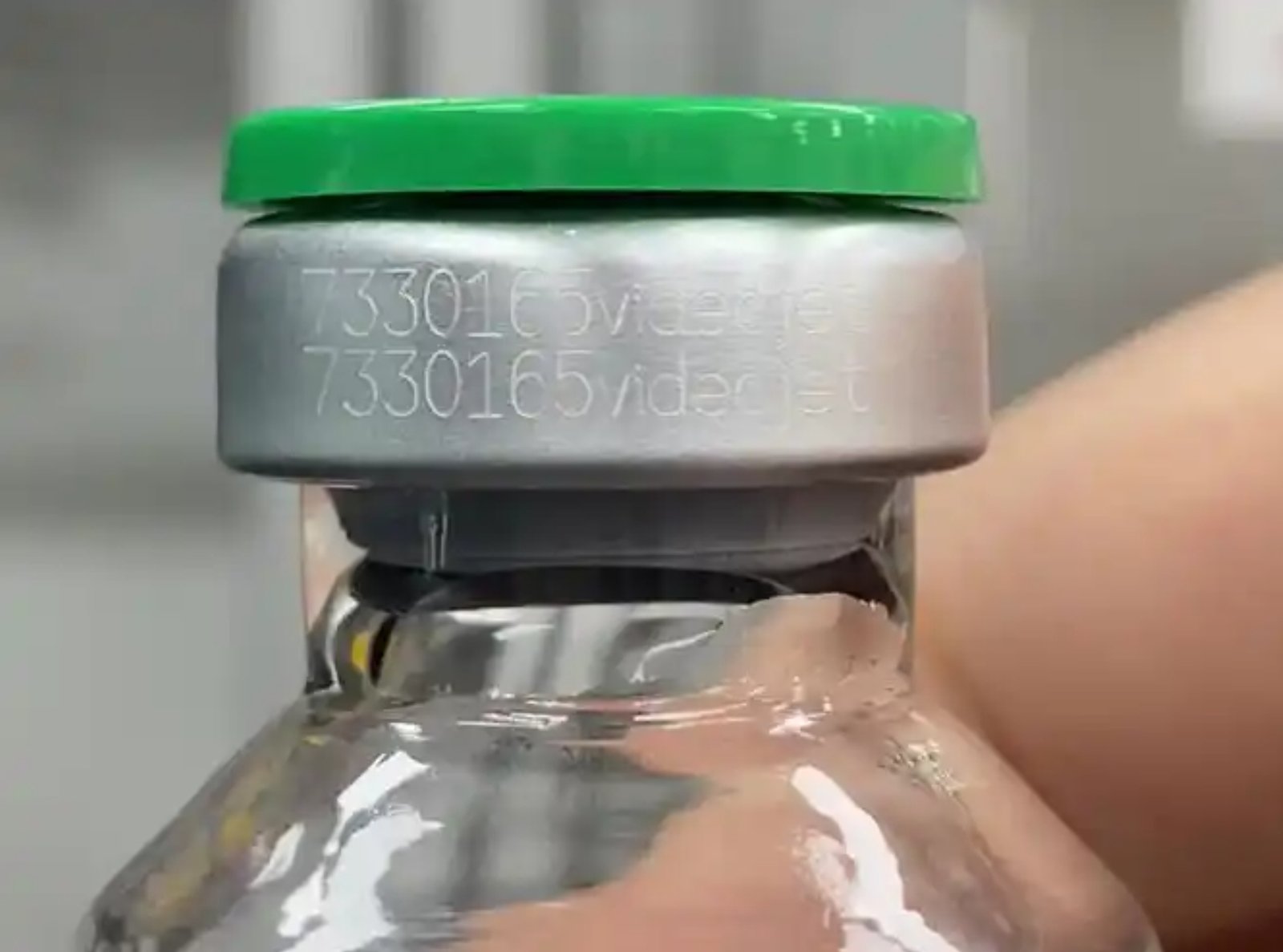 Laser-engraved batch number and text on a medical vial cap