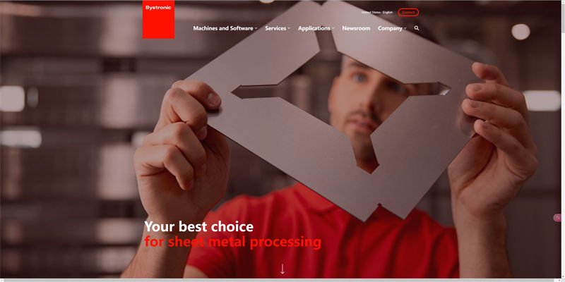 A technician holding a precision-cut metal part in front of the Bystronic website page.