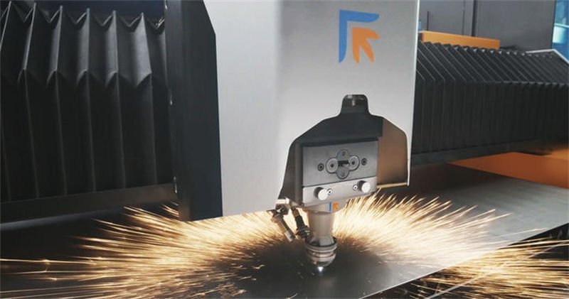 Prima fiber laser cutter actively cutting a metal sheet.