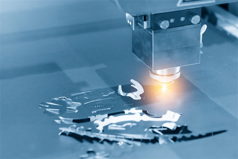 Close-up of a laser cutting machine precision cutting a galvanized sheet into intricate shapes