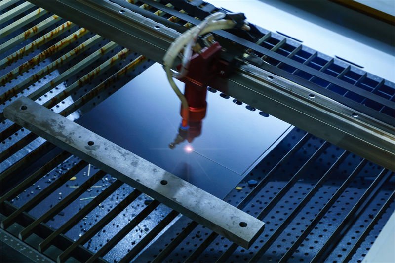 CO2 laser cutting through a sheet of acrylic