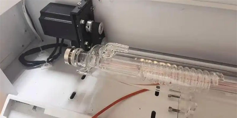 A CO2 laser tube in a machine setup