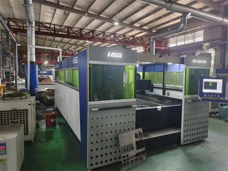 Industrial laser cutting machine setup in a factory setting