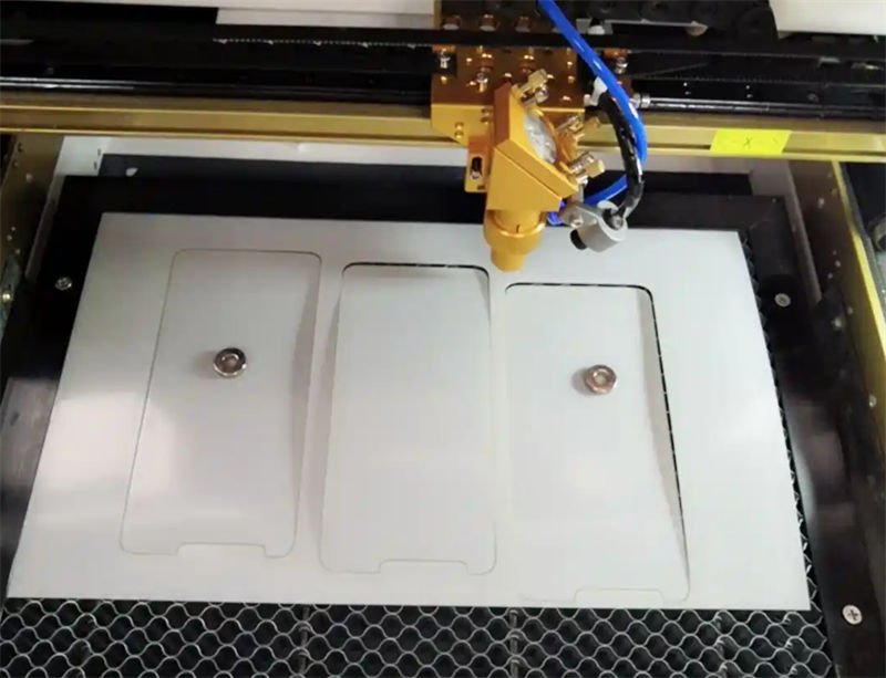 A laser cutting machine processing ceramic sheets with precision